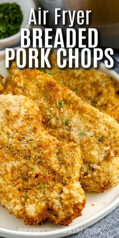 Air fryer breaded pork chops on a serving plate with a title