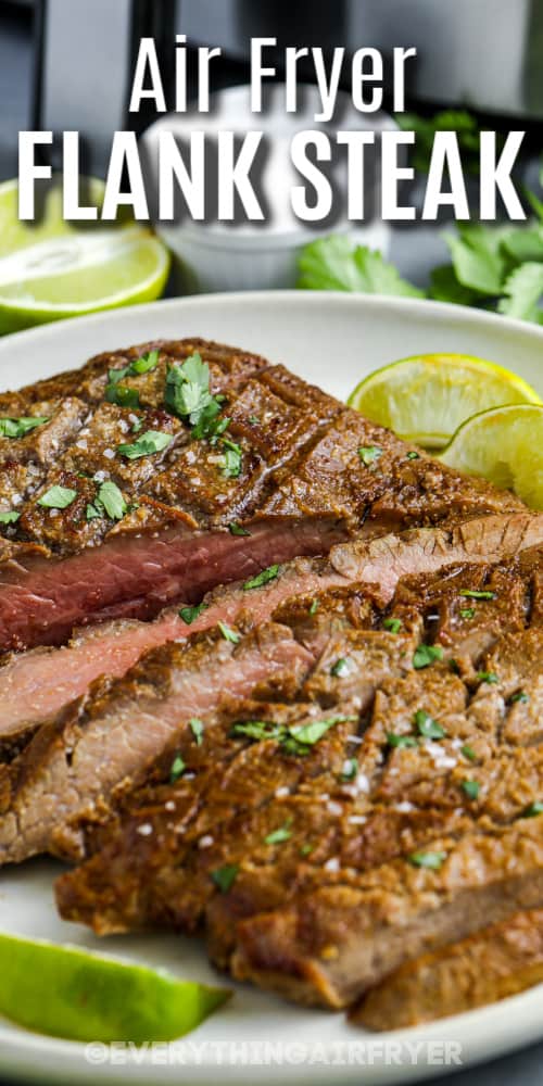 Air Fryer Flank Steak sliced on a serving plate with a title